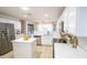 Modern kitchen featuring white cabinets, stainless steel appliances, and a center island at 13451 S 47Th Way, Phoenix, AZ 85044