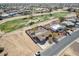 Home aerial showcasing desert landscaping, a pool, and location near a golf course at 14493 S Country Club Dr, Arizona City, AZ 85123