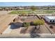 Aerial view of desert home near a golf course, with trees and a convenient front driveway at 14493 S Country Club Dr, Arizona City, AZ 85123