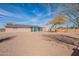 Large backyard includes desert landscaping and privacy at 14493 S Country Club Dr, Arizona City, AZ 85123