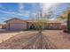 Charming single-story home with desert landscaping, attached garage, and unique architectural details at 14493 S Country Club Dr, Arizona City, AZ 85123