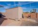 Outdoor storage shed on a concrete block foundation and surrounded by gravel at 14493 S Country Club Dr, Arizona City, AZ 85123