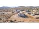 Aerial view of the home in the desert community showing the surrounding landscape at 1510 E Red Range Way, Phoenix, AZ 85085