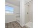 Bright bathroom featuring a shower, tub, and a view of the desert at 1510 E Red Range Way, Phoenix, AZ 85085