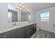 Bathroom with dual sink vanity, modern fixtures, and separate shower and tub at 1510 E Red Range Way, Phoenix, AZ 85085