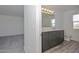 Bathroom featuring double vanity, modern fixtures, and wood-style flooring at 1510 E Red Range Way, Phoenix, AZ 85085