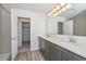 Bathroom featuring a shower and vanity, with a view into the closet at 1510 E Red Range Way, Phoenix, AZ 85085