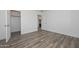 Bedroom with wood-style flooring and a walk-in closet at 1510 E Red Range Way, Phoenix, AZ 85085