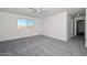 Bedroom with mountain view out of window, carpet floors, and ceiling fan at 1510 E Red Range Way, Phoenix, AZ 85085