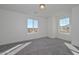 Bright bedroom with natural light, carpet, and a view of the desert landscape at 1510 E Red Range Way, Phoenix, AZ 85085