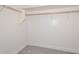 Walk-in closet with basic shelving and carpeting for ample storage at 1510 E Red Range Way, Phoenix, AZ 85085