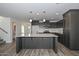 Modern kitchen featuring gray cabinets, white countertops, stainless steel appliances, and hardwood floors at 1510 E Red Range Way, Phoenix, AZ 85085