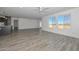 Spacious living room with wood floors and views of the surrounding desert landscape from the large windows at 1510 E Red Range Way, Phoenix, AZ 85085