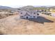 Aerial shot of the home's rear, showing ample windows and desert views at 1510 E Red Range Way, Phoenix, AZ 85085