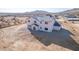 Aerial shot of the home's rear, showing ample windows and desert views at 1510 E Red Range Way, Phoenix, AZ 85085