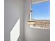 Window with a view of the desert and mountains, illuminated by an elegant hanging light at 1510 E Red Range Way, Phoenix, AZ 85085