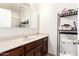 Bathroom featuring large vanity with marble countertop and mirror, with a toilet to the right at 1549 W Peralta Ave, Mesa, AZ 85202