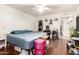 Bright bedroom featuring hardwood floors, white walls and ceiling, and neutral decor at 1549 W Peralta Ave, Mesa, AZ 85202