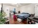 Bedroom featuring bright walls, a ceiling fan, and a large window overlooking a yard at 1549 W Peralta Ave, Mesa, AZ 85202