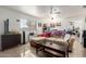 Relaxing living room features neutral tones, tile floors, and a ceiling fan at 1549 W Peralta Ave, Mesa, AZ 85202