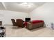 Bright living room with tile floors, modern furniture, and a ceiling fan at 1549 W Peralta Ave, Mesa, AZ 85202