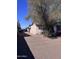 Side view of the yard with large tree providing shade and potential for landscaping at 1634 S 5Th St, Phoenix, AZ 85004