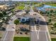 Aerial view of the community entrance with manicured landscaping, a roundabout, and a water feature at 17192 W Rocklin St, Surprise, AZ 85388