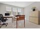 Home office featuring natural light and elegant wooden furniture at 17192 W Rocklin St, Surprise, AZ 85388