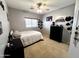 Cozy bedroom with natural lighting and a ceiling fan at 17420 W Mohave St, Goodyear, AZ 85338