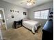 Bedroom painted with neutral tones, natural light, and wall decor at 17420 W Mohave St, Goodyear, AZ 85338