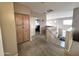 Upstairs hallway with stairway, carpet, and built in storage at 17420 W Mohave St, Goodyear, AZ 85338