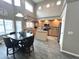 Bright kitchen features wooden cabinetry, stainless appliances, tile floors, and a center island at 17420 W Mohave St, Goodyear, AZ 85338