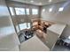 Aerial view of a bright kitchen with wooden cabinetry, stainless appliances, and tile floors at 17420 W Mohave St, Goodyear, AZ 85338