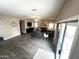 Bright living room with wood floors and neutral paint color. Large sliding doors provide access to the backyard at 17420 W Mohave St, Goodyear, AZ 85338