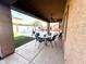 Covered patio with outdoor seating, ceiling fan, and views of the backyard and swimming pool at 17420 W Mohave St, Goodyear, AZ 85338