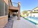 Home's outdoor space offers a covered patio with a backyard pool to bring more leisure and fun at 17420 W Mohave St, Goodyear, AZ 85338