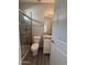 Interior bathroom featuring a glass shower, granite vanity top, and a three-bulb vanity light at 1743 W Pollack St, Phoenix, AZ 85041