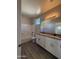 Bathroom featuring dual sinks, granite countertop vanity, tile flooring, and combination shower with tub at 1743 W Pollack St, Phoenix, AZ 85041