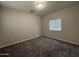 Bright bedroom with gray carpet, a window, and neutral paint at 1743 W Pollack St, Phoenix, AZ 85041