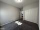 Bedroom featuring gray carpet, a closet with sliding doors, and a window at 1743 W Pollack St, Phoenix, AZ 85041