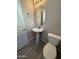 View of a half bathroom featuring a pedestal sink and tile flooring at 1743 W Pollack St, Phoenix, AZ 85041