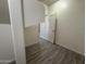 Hallway features wood-look tile flooring and a white door at 1743 W Pollack St, Phoenix, AZ 85041