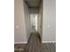 Hallway view featuring tile floors and views of a bedroom and the backyard at 1743 W Pollack St, Phoenix, AZ 85041