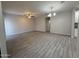 Spacious living room featuring tile flooring, ceiling fans, and ample natural light at 1743 W Pollack St, Phoenix, AZ 85041