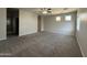 Spacious living room with gray carpet and views of a bathroom at 1743 W Pollack St, Phoenix, AZ 85041