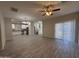 Open-concept living area with tile flooring, recessed lights, and large sliding glass door at 1743 W Pollack St, Phoenix, AZ 85041