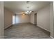 Expansive living area with tile flooring, recessed lighting, and sliding glass door at 1743 W Pollack St, Phoenix, AZ 85041