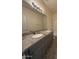 Bathroom featuring double sinks, granite countertop, and tile flooring at 1745 W Pollack St, Phoenix, AZ 85041