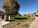 Community park near homes featuring grassy field, trees, sidewalks and mailboxes at 1745 W Pollack St, Phoenix, AZ 85041