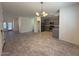 Spacious open floor plan with tile floors and view of the kitchen and a dining area at 1745 W Pollack St, Phoenix, AZ 85041